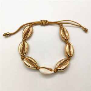Bracelet Cauri Coquillage Or. Acheter vos vêtements africains en ligne sur Monde Africain.com .